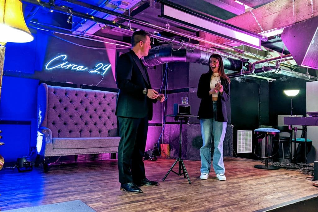 Mentalist Jonathan Pritchard with a participant during his mind reading show in Asheville North Carolina